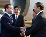 Russian President Dmitry Medvedev (left in the foreground), arriving to attend the Second ASEAN – Russia Summit, during a welcoming ceremony at the Hanoi Airport. On the right in the foreground is Ambassador Extraordinary and Plenipotentiary of the Socialist Republic of Vietnam to Russia Bui Dinh Dinh.